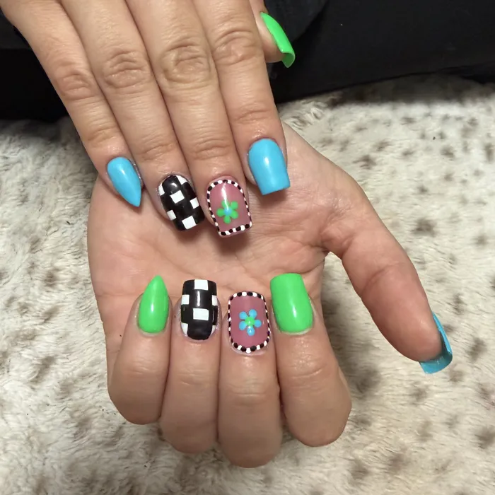 Short square nails in neon green and sky blue with checkerboard and flower accent nails